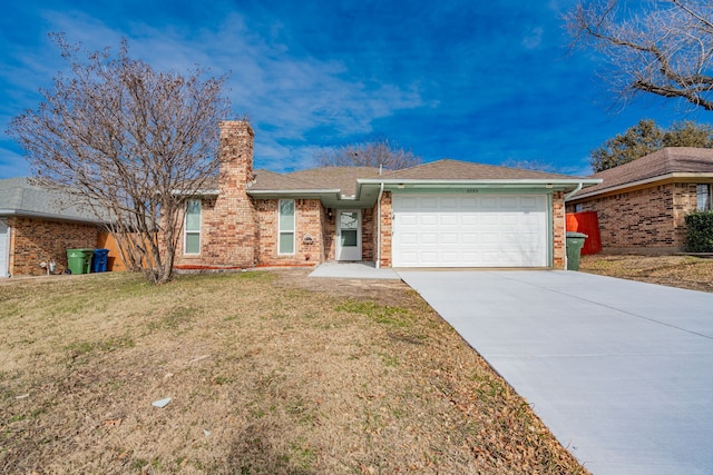 ranch-style home with a garage and a front lawn