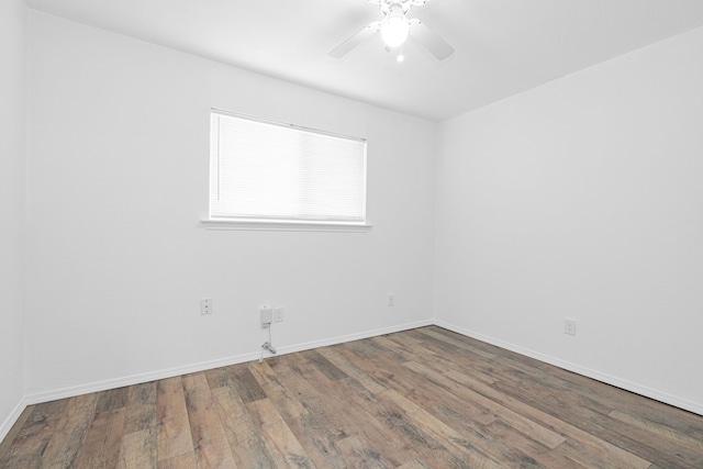 spare room featuring hardwood / wood-style flooring and ceiling fan