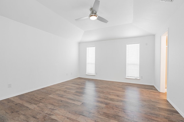 spare room with dark wood-type flooring, ceiling fan, and lofted ceiling