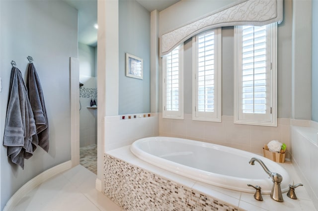 bathroom featuring tile patterned floors, shower with separate bathtub, and a healthy amount of sunlight