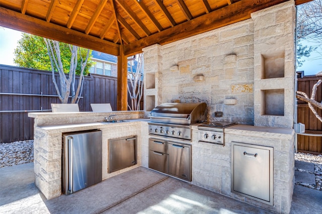 view of patio / terrace with a gazebo, area for grilling, and a grill