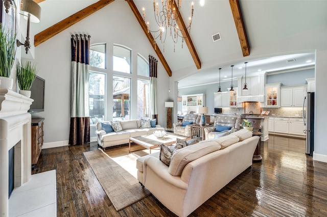 living room with beamed ceiling, dark hardwood / wood-style floors, an inviting chandelier, and high vaulted ceiling