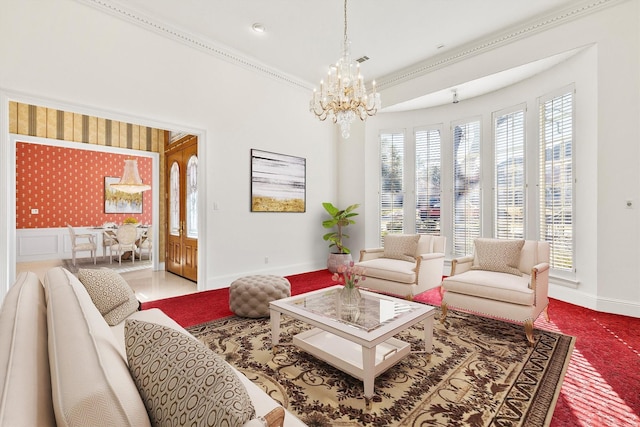 carpeted living room featuring ornamental molding and an inviting chandelier