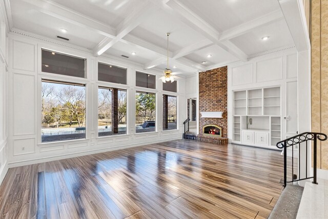 carpeted bedroom with crown molding, ceiling fan, a fireplace, and access to outside