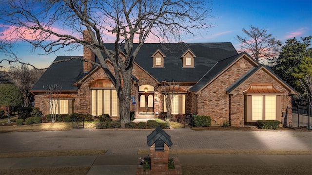 view of front of property featuring brick siding