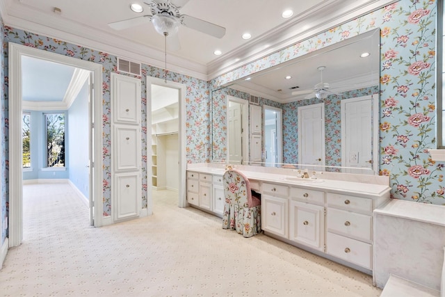 bathroom featuring crown molding, vanity, and ceiling fan