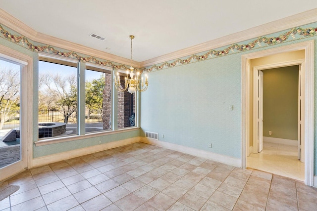 unfurnished dining area with an inviting chandelier, ornamental molding, and tile patterned floors