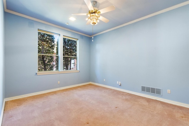 carpeted empty room with crown molding and ceiling fan