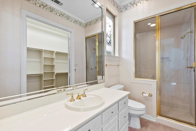 full bathroom with visible vents, vanity, a shower stall, and toilet