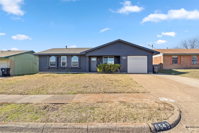 ranch-style house with a garage and a front yard