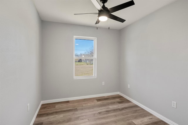 empty room featuring ceiling fan and light wood-type flooring