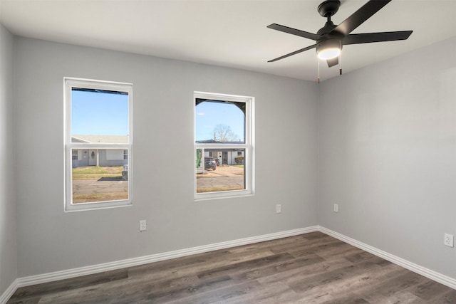 unfurnished room with hardwood / wood-style flooring, ceiling fan, and a healthy amount of sunlight