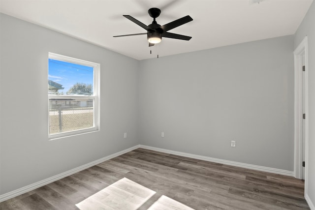 empty room with wood-type flooring and ceiling fan