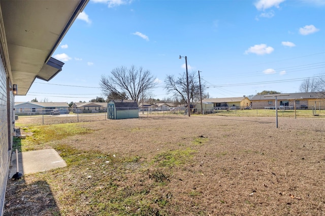 view of yard featuring a storage unit