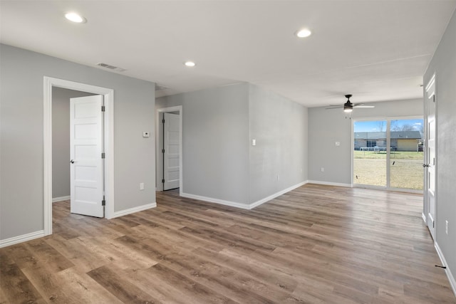 spare room featuring ceiling fan and wood-type flooring