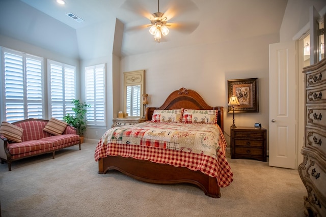 bedroom with ceiling fan and light carpet