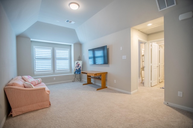 sitting room with lofted ceiling and light carpet