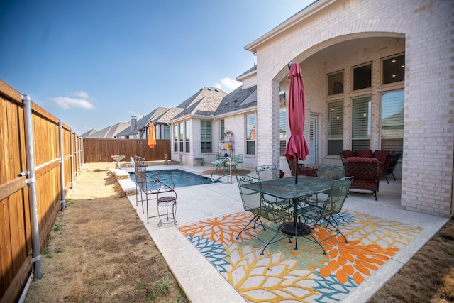 view of pool featuring a patio