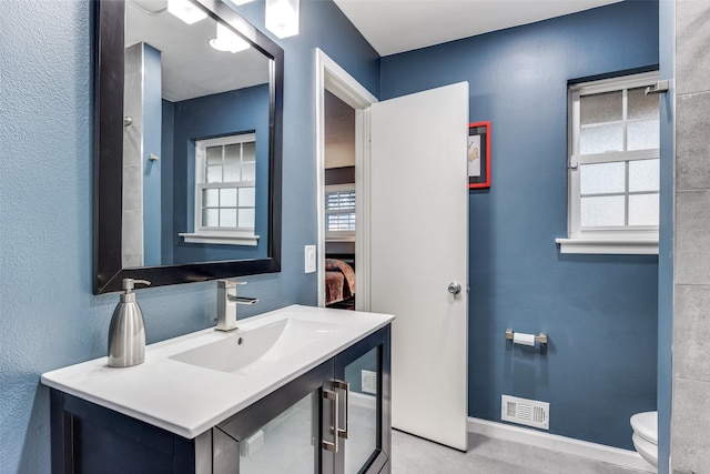 bathroom featuring sink and toilet