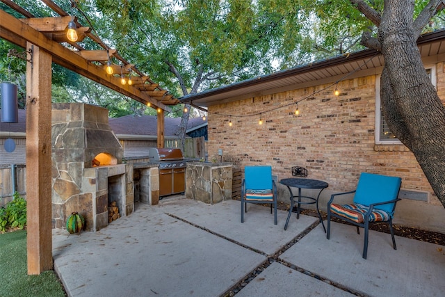 view of patio / terrace featuring area for grilling, a pergola, and exterior kitchen