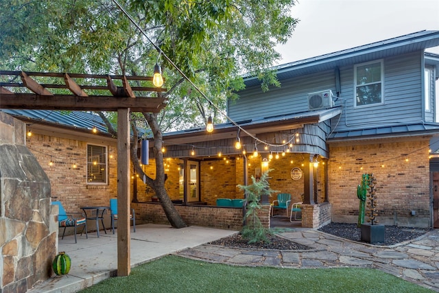 back of house with a patio and a pergola