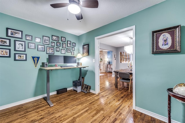 office area featuring wood-type flooring and ceiling fan