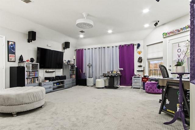 carpeted living room featuring lofted ceiling