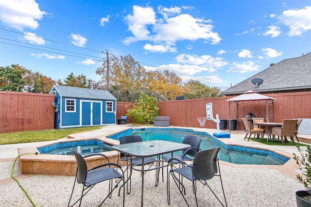 view of pool with a gazebo, a storage shed, and a patio area