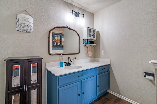 bathroom featuring vanity and wood-type flooring