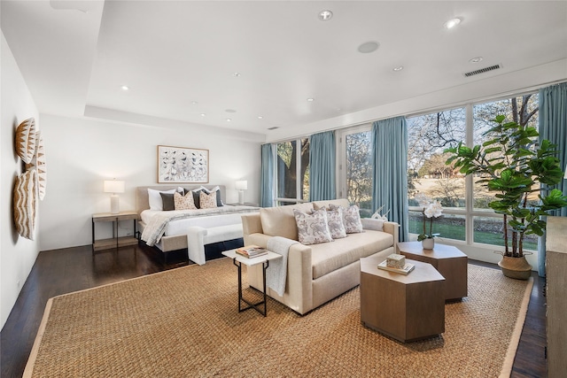 bedroom with visible vents, wood finished floors, and recessed lighting