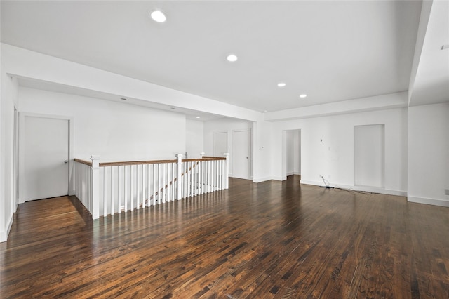 unfurnished room featuring recessed lighting, baseboards, and wood finished floors