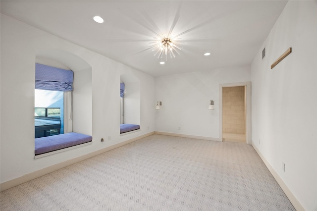 empty room featuring an inviting chandelier, baseboards, visible vents, and recessed lighting