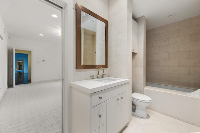 full bathroom with toilet, recessed lighting, baseboards, and vanity