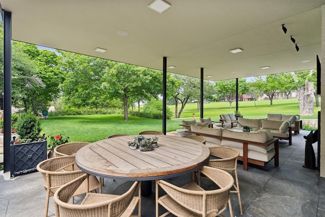 view of patio / terrace featuring outdoor dining space and an outdoor hangout area