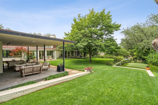 view of yard featuring a patio area and an outdoor living space