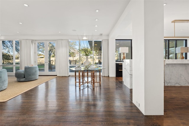 dining area with french doors, wood finished floors, and recessed lighting