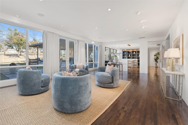 living room featuring french doors, wood finished floors, and recessed lighting