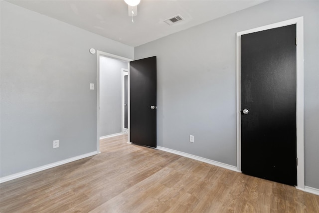 unfurnished room featuring light wood-type flooring