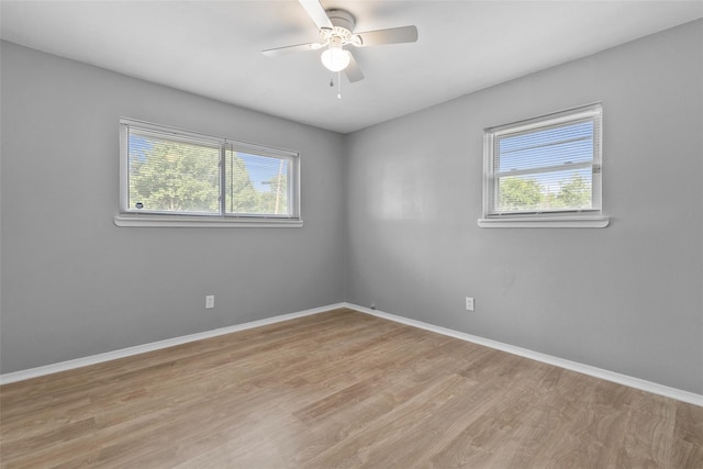 unfurnished room with ceiling fan and light hardwood / wood-style flooring