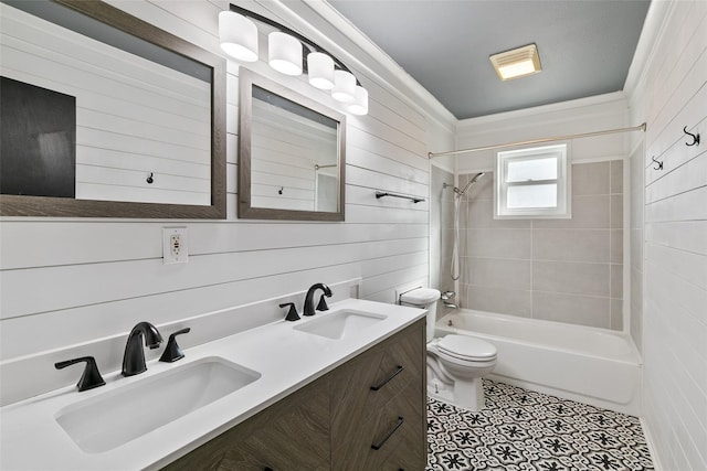 full bathroom featuring vanity, tile patterned flooring, tiled shower / bath combo, and toilet