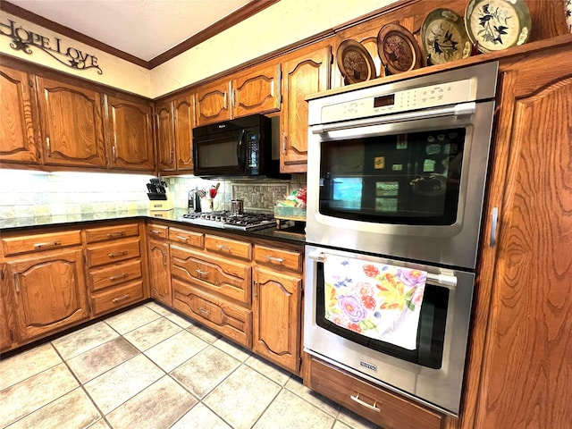 kitchen with tasteful backsplash, light tile patterned floors, ornamental molding, and appliances with stainless steel finishes