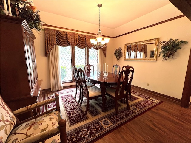 dining area featuring hardwood / wood-style flooring and a chandelier