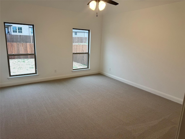 empty room with carpet floors and ceiling fan