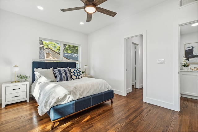 bedroom with ceiling fan and dark hardwood / wood-style flooring