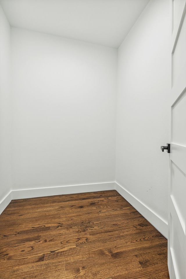 empty room with dark wood-type flooring