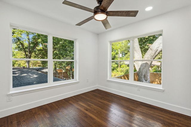 spare room with wood-type flooring and ceiling fan