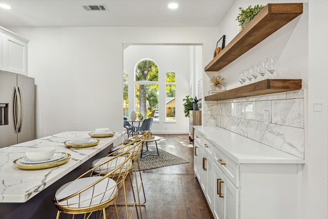 dining area with dark hardwood / wood-style flooring