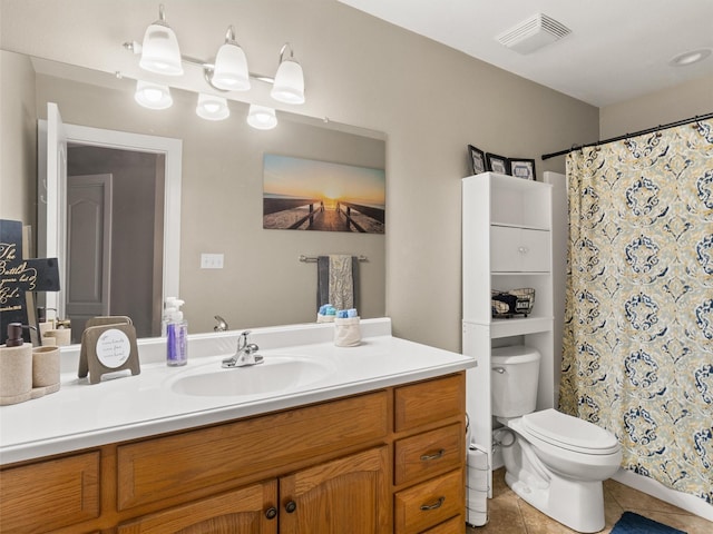 bathroom featuring a shower with curtain, vanity, tile patterned floors, and toilet