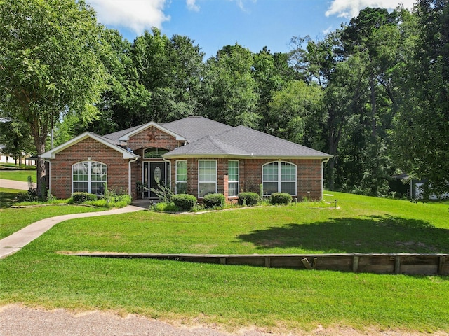 ranch-style house featuring a front yard