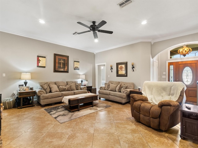 living room with light tile patterned floors, ornamental molding, and ceiling fan